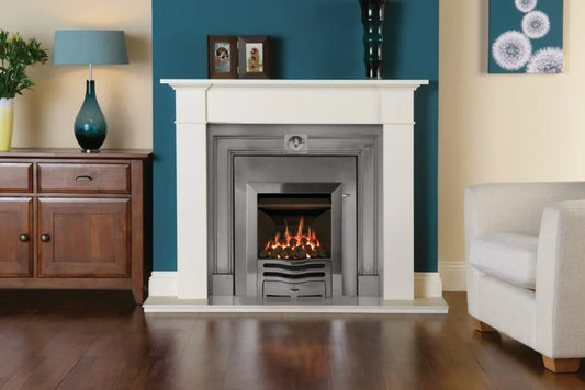 Logic Convector conventional flue fire (Slide control) with Highlight Polished Wave front. Shown with white Claremont stone mantel, Polished Burlington Cast front and Insert Panel.
