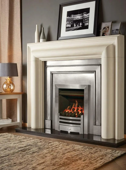 Logic Convector conventional flue fire with Highlight Polished Arts front. Shown with Grafton Limestone mantel, Polished Belgravia Cast front and Insert Panel.