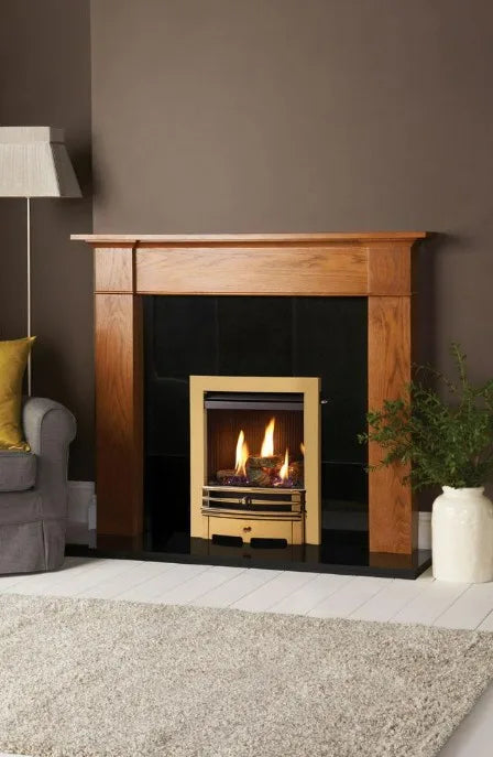 Logic HE conventional flue fire (Slide control) with log-effect and Brass-effect Chartwell front. Shown with rich oak-effect Brompton wooden mantel